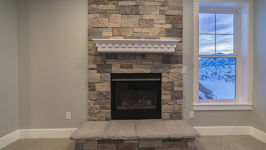  a clean stone brick fireplace