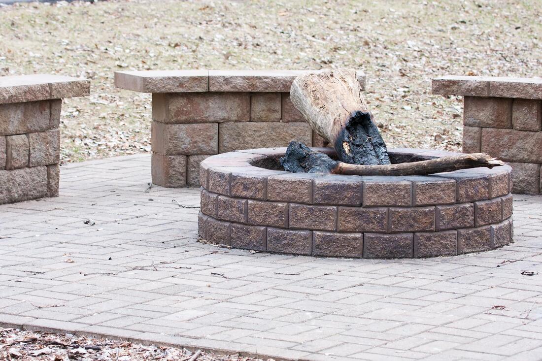 a brick bench and brick fire stone 